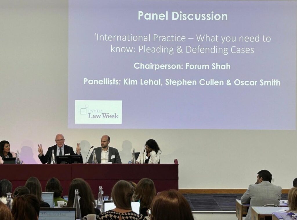 Oscar Smith with his co-panellist on stage at the Family Law Week International Childrens Conference